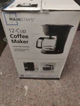 Mainstays Black 12-CUP Drip Coffee Maker New Box. Fixed Price $13.87.